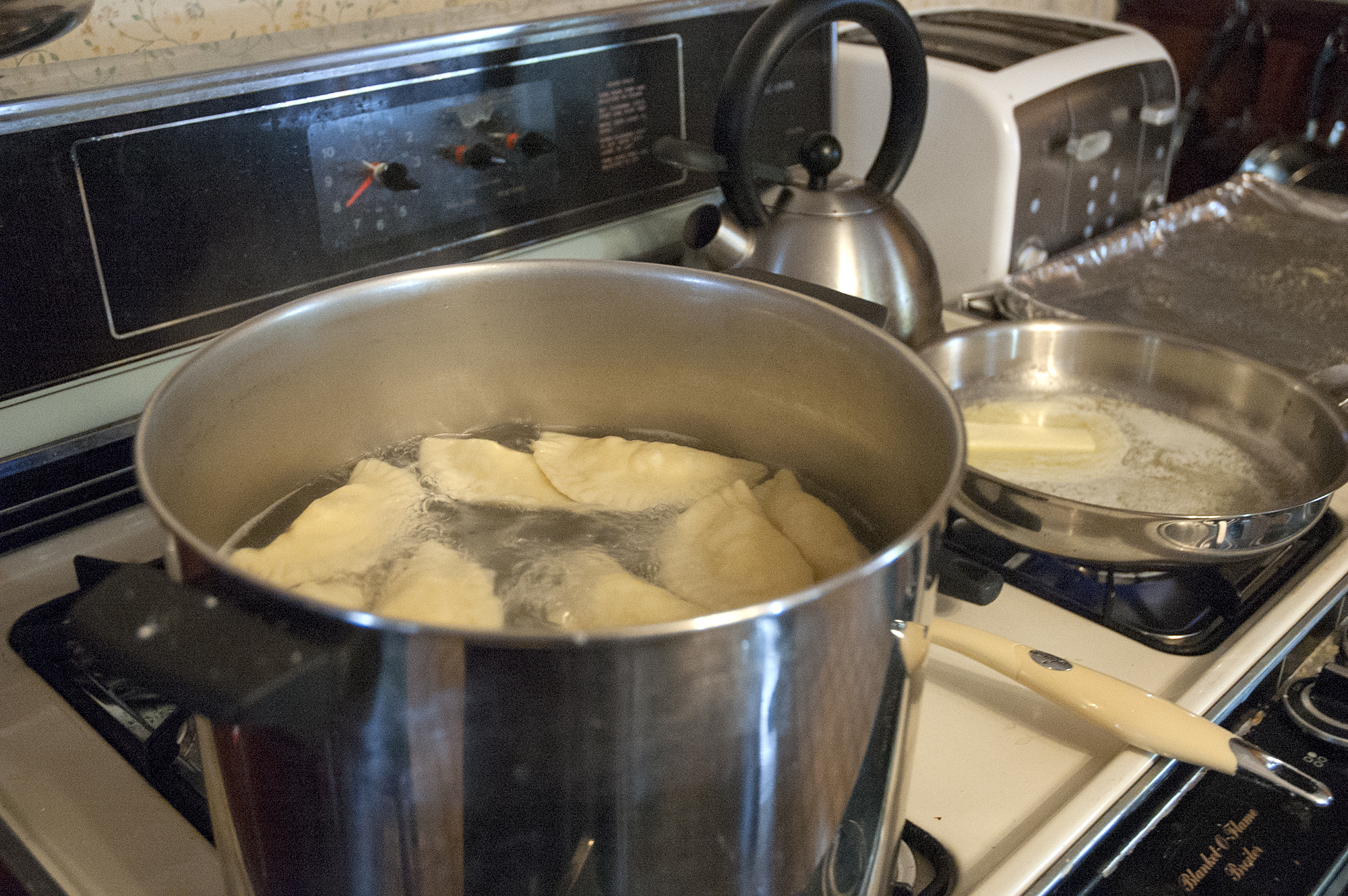Pot with ravioli being cooked.