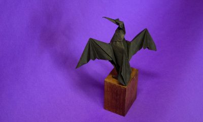 Origami Cormorant Drying its Wings, designed and folded by Michael LaFossse in handmade paper by Richard Alexander.