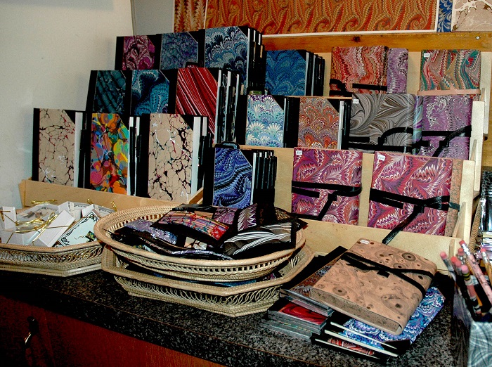 Marbled paper and books for sale.