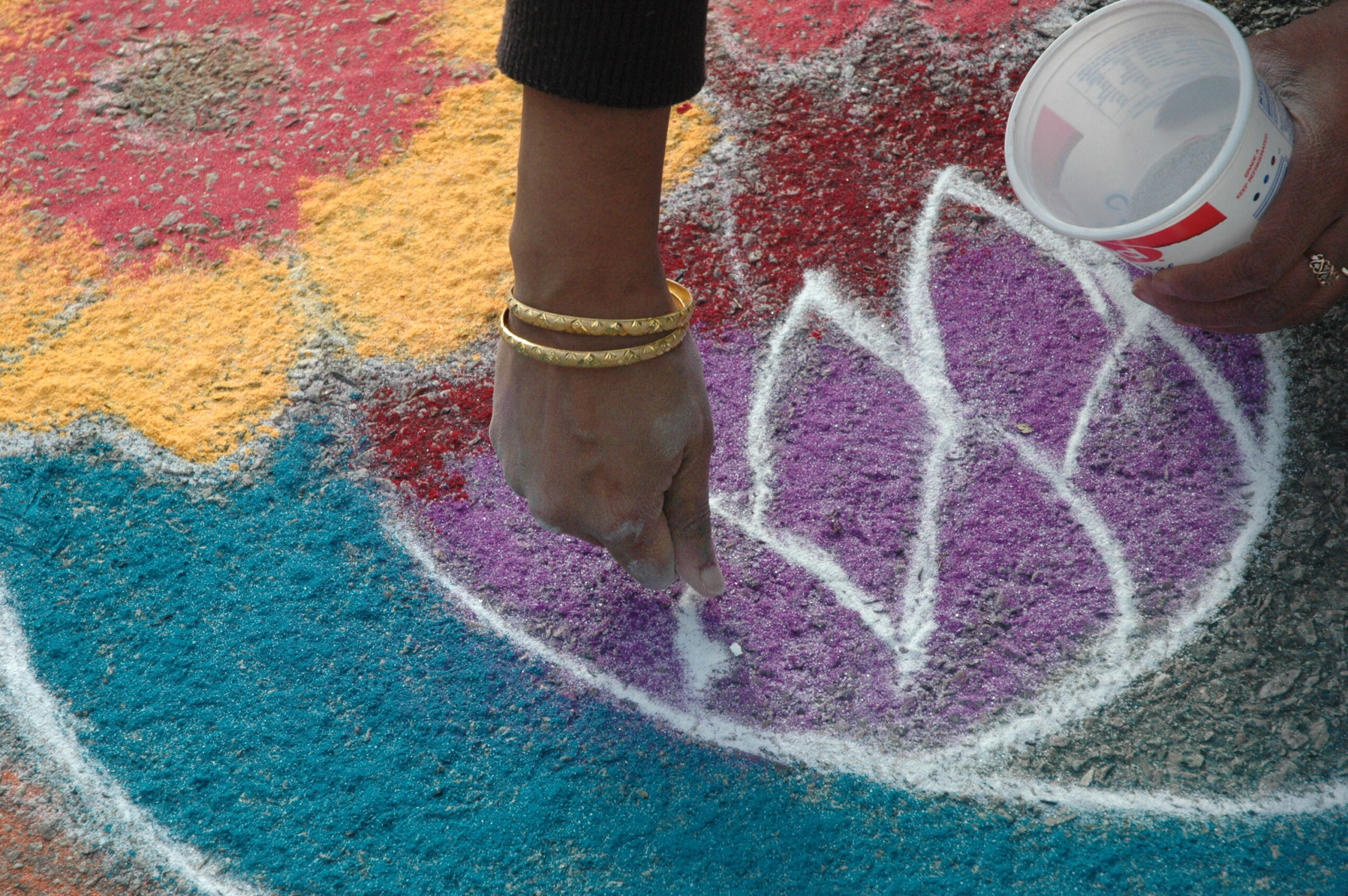 Sridevi sprinking powdered chalk.