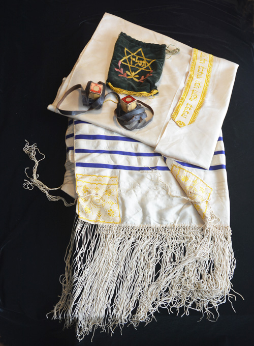 Tallis, tefillin, and velvet bag belonging to Maggie's father.