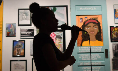 Young woman performing at Elevated Thought gallery