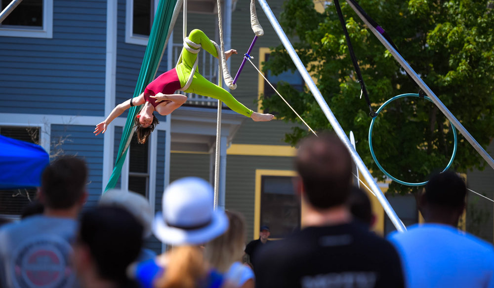 photo of an aerial artist performing at an outdoor festival