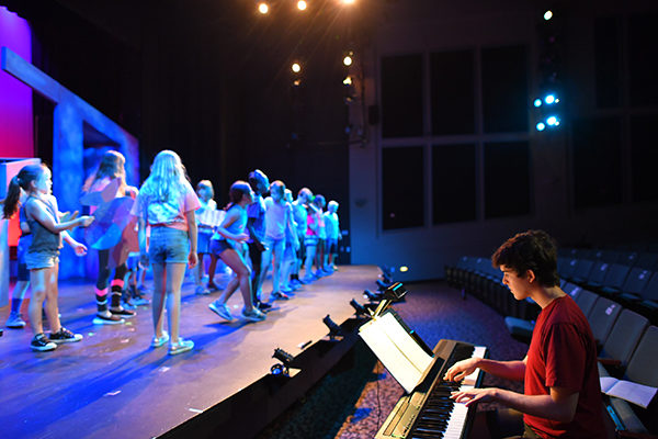Young people rehearse on the stage of Greater Boston Stage Company in Stoneham, MA.