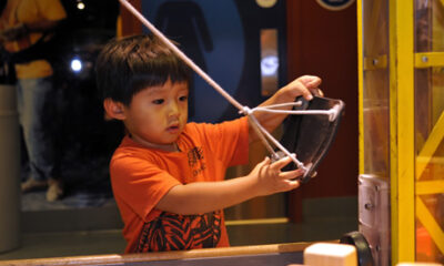 A young boy plays in the Construction Zone at Boston Children's Museum
