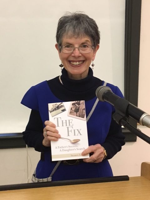 Sharon Leder, Founder of Creative Outlets at Cape Cod Museum of Art, holds a copy of her book, The Fix: A Father's Secrets, A Daughter's Search.