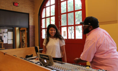 Corey DePina, musician and Youth Development and Performance Manager at Zumix, talks with a youth musician.