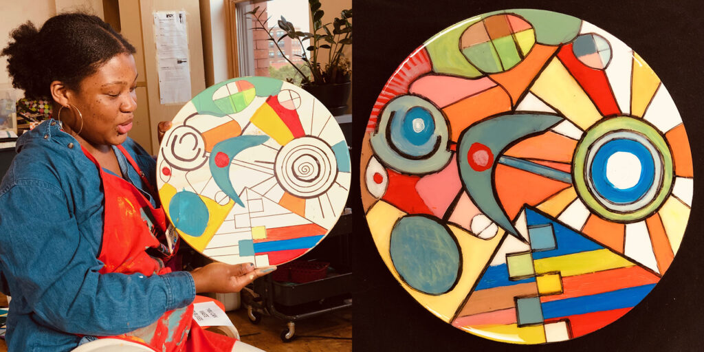 Hannah Parker holding a piece of spinning art she created