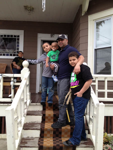 Stelvyn Mirabal and children at his home in Lawrence, MA.