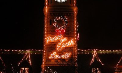 Nigh time photo of Lowell City Hall with Christmas lights.