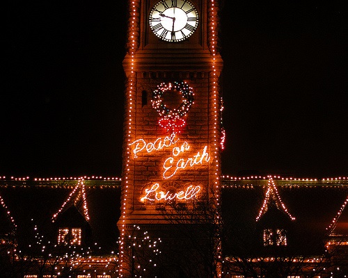 Nigh time photo of Lowell City Hall with Christmas lights.