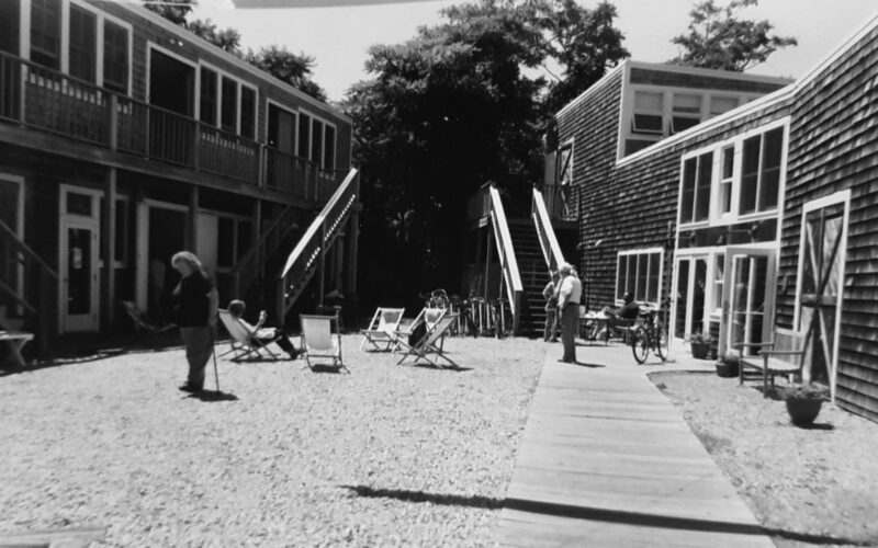 People scattered in courtyard at the Fine Art Works Center in Provincetown