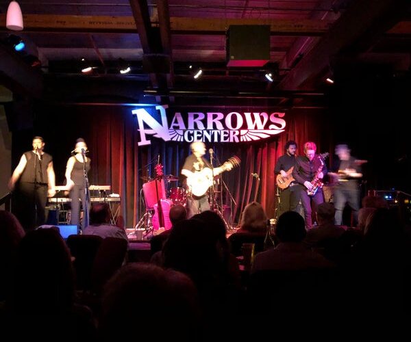 Band performing onstage at the Narrows Center for the Arts