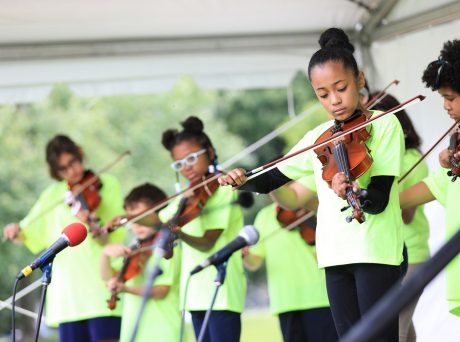 youth ensemble playing at an outside arts festival