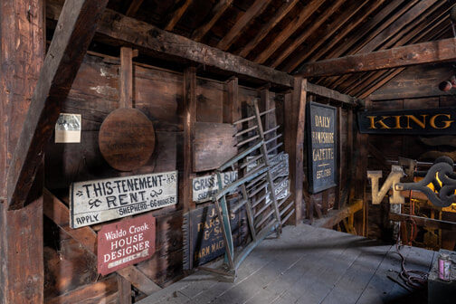 Antique signs hung inside the Sheppard Barn