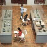 3 people sketching in the Armenian Museum Gallery.