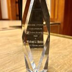 photo of a crystal award object with the inscription MassOpera proudly presents the Action Bearing Award to Michael J. Bobbitt