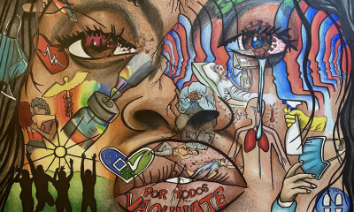 Photo detail of a mural depicting a face and over the face are images evoking public health and community and encouragement to get vaccinated