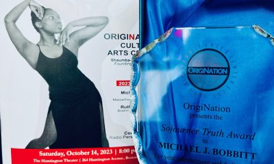 photo of a program cover for the Twist & Shout event and the award object for Michael J. Bobbitt's Sojourner Truth Award, a crystal plaque