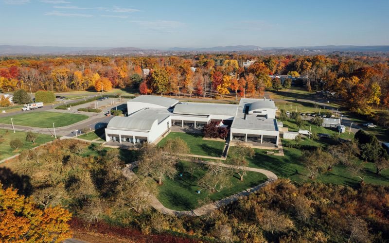 Aerial view of the Eric Carle Museum of Picture Book Art's campus buildings during autumn