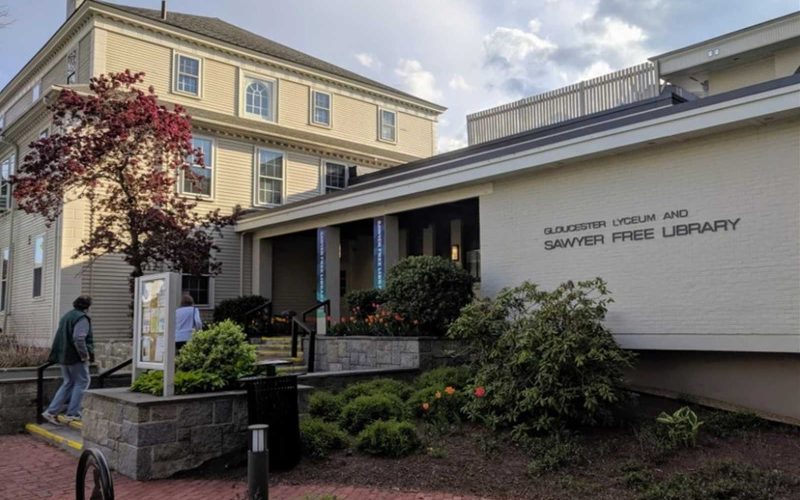 Brick walk ways and landscaped garden beds outside the entrance of the Gloucester Lyceum and Sawyer Free Library