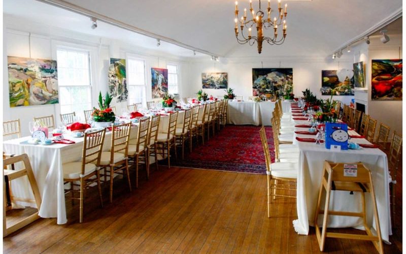 Event tables and seating within a gallery space