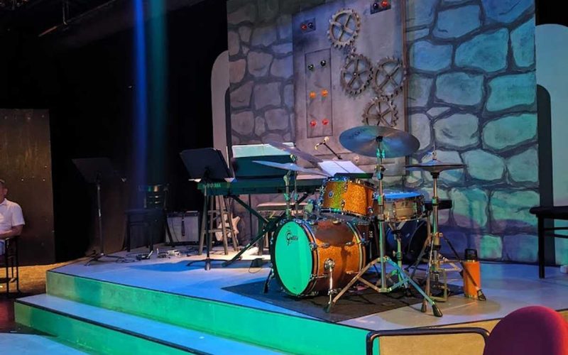 Musical instruments set up on stage at the Provincetown Theatre