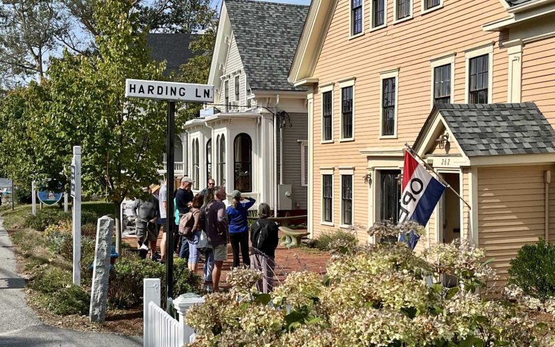 People gathered on the sidewalk outside the Wellfleet Historical Society & Museum