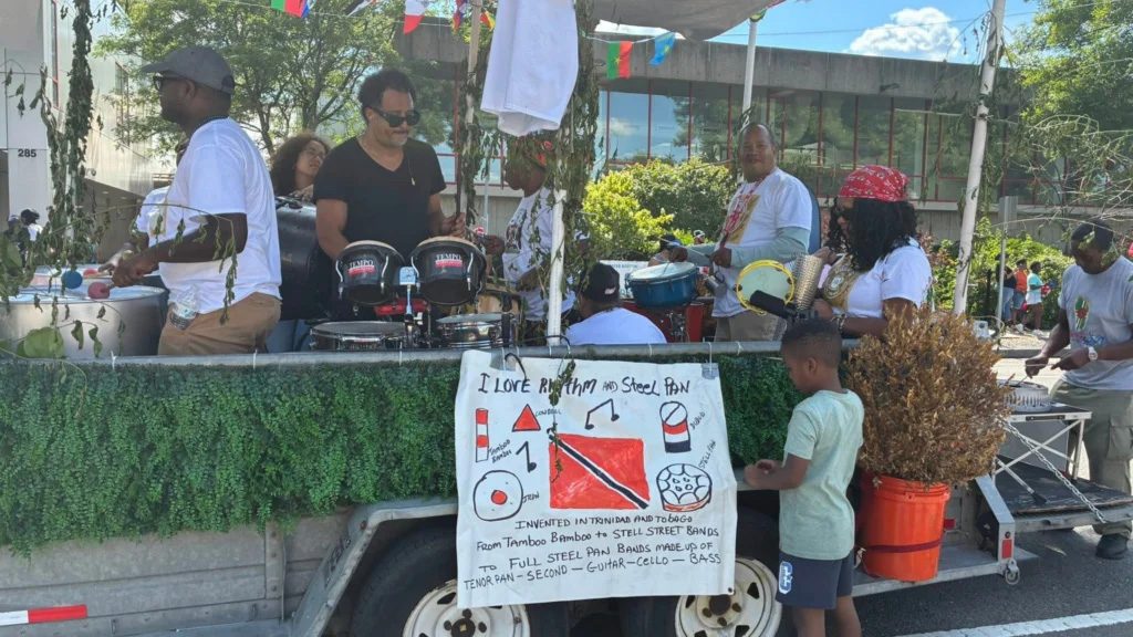 photo of a band playing rhythm instruments at an outside event.