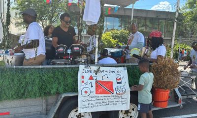photo of a band playing rhythm instruments at an outside event.