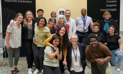 group photo of about 10 teens smiling with a handful of adults.