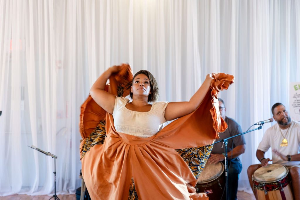photo of an Afro-Puerto Rican dancer and musicians performing.