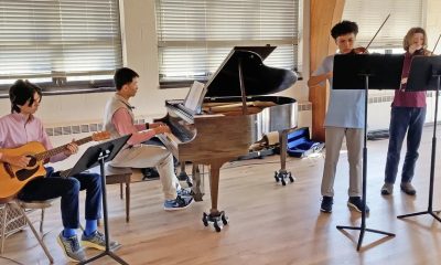 photo of 4 youth musicians performing.
