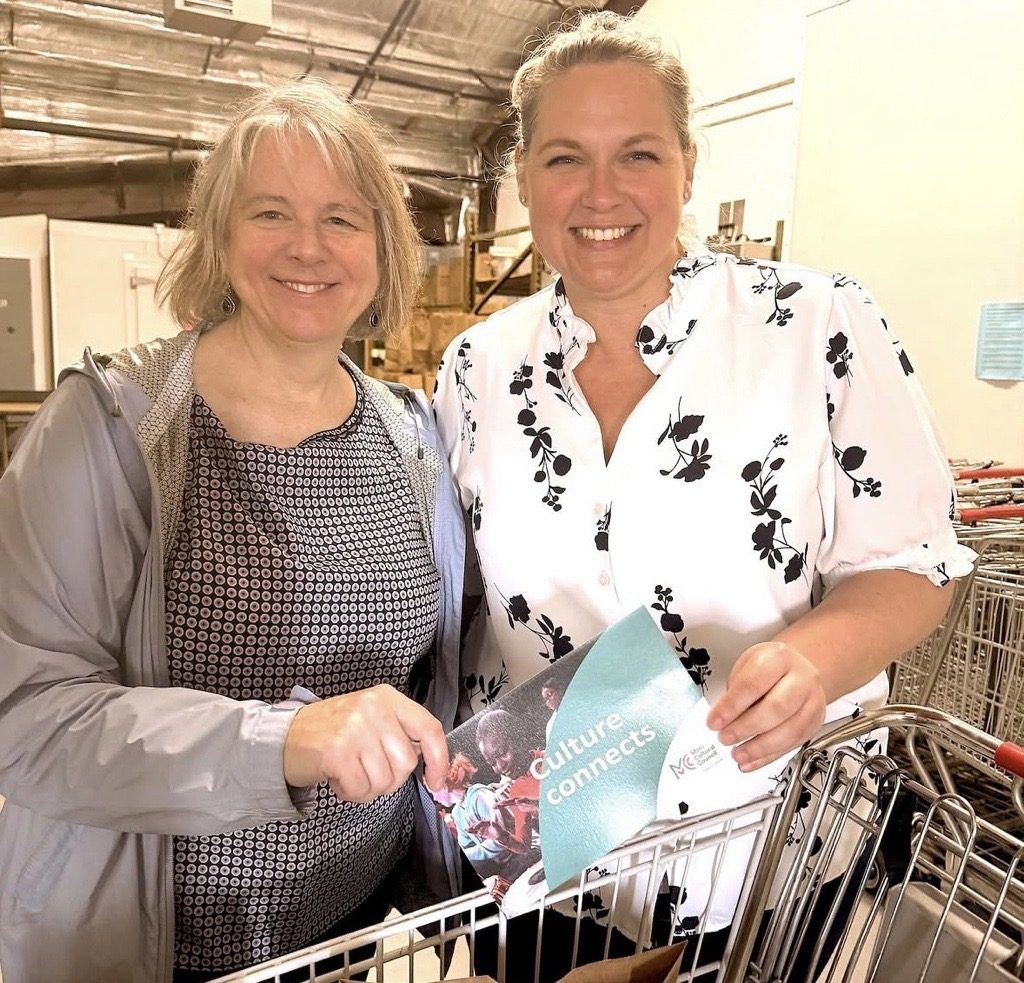 photo of two smiling women.