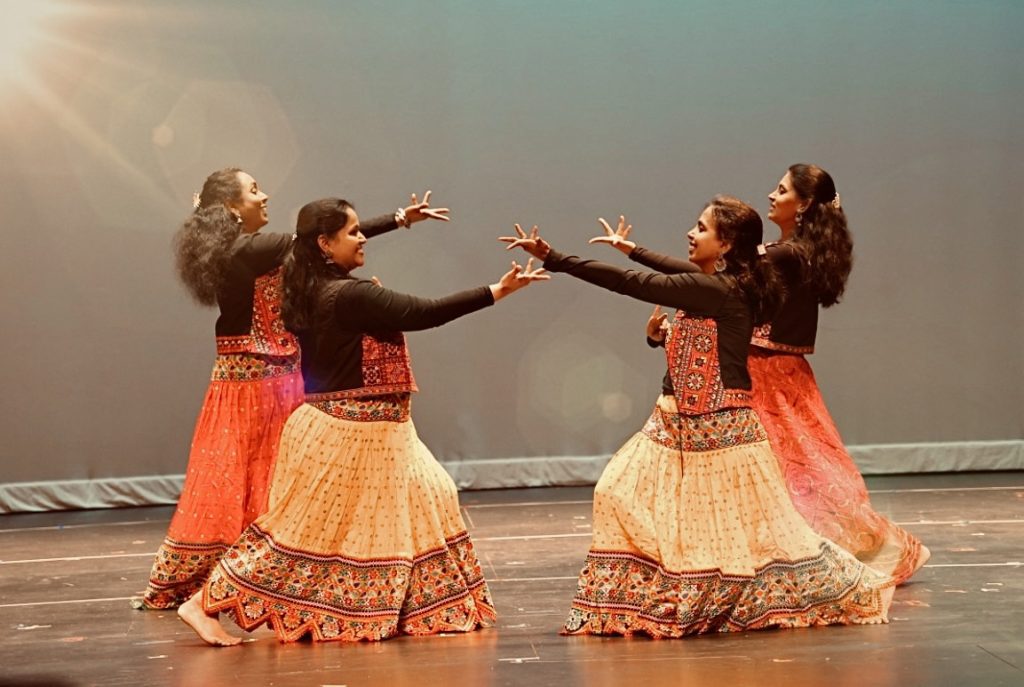 photo of 4 dancers performing.