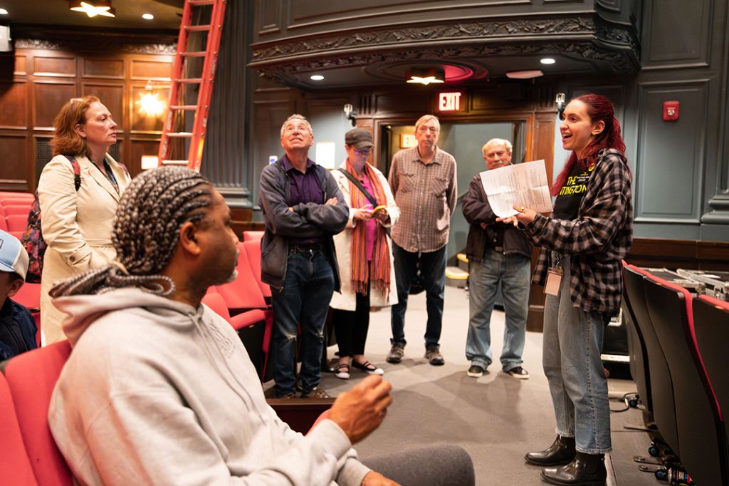 photo of people getting a tour inside the Huntington Theater