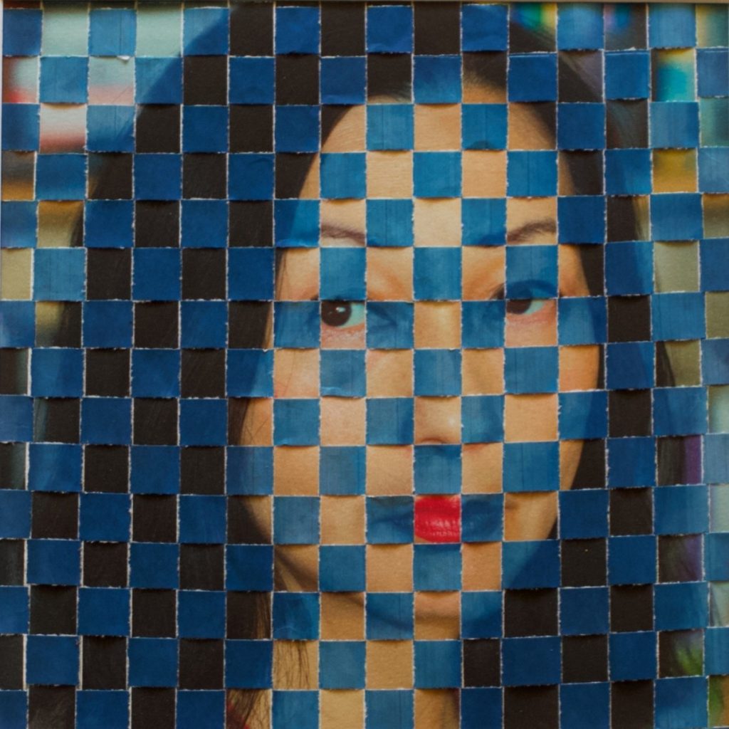 A photographic portrait of a woman, her face interwoven with blue squares.
